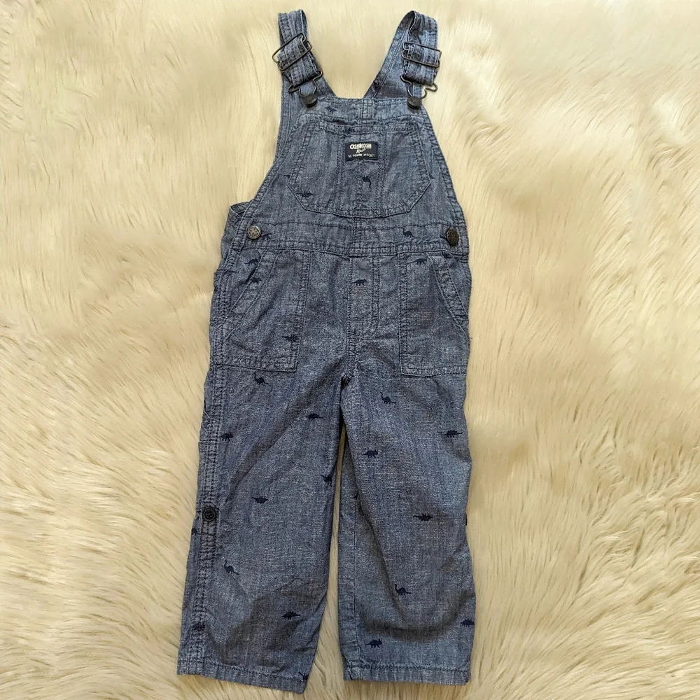 Oshkosh B'gosh blue overalls with navy blue dinosaur print size 2T